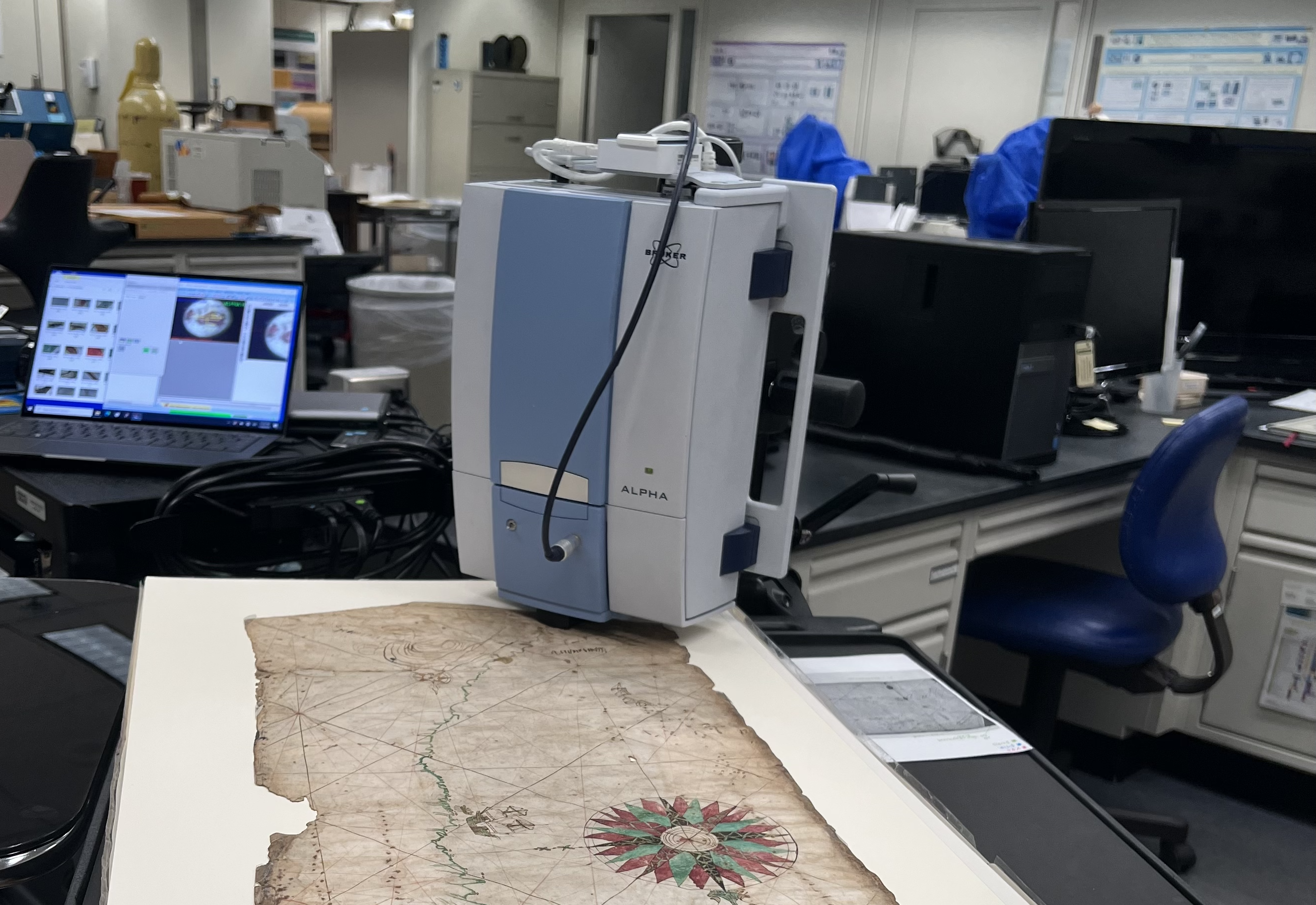 Infrared spectrometer and old map.