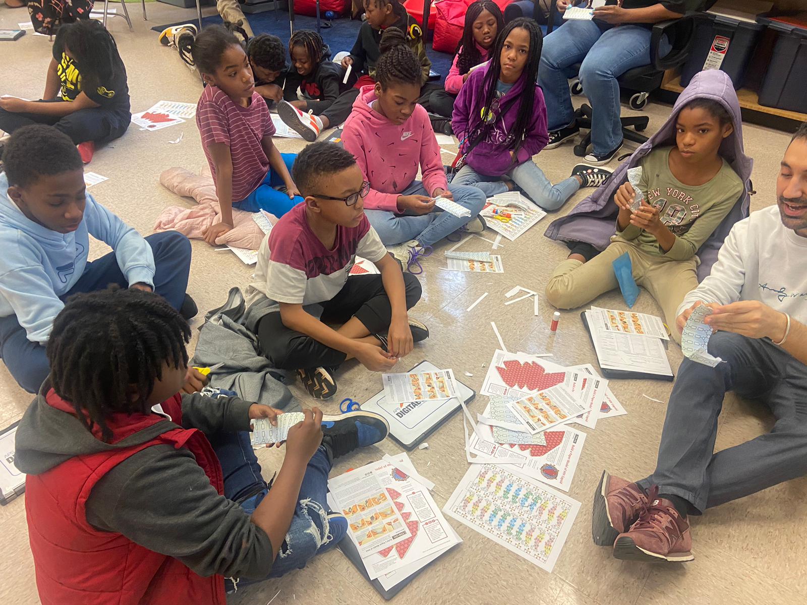 Postdoc Bruno Di Geronimo and Finch Elementary students explore DNA.