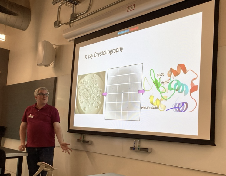 Dr. Dustin Huard (Research Scientist, Chemistry & Biochemistry) teaches high school students about X-ray crystallography – one of the main techniques to understand atomic structures of biomolecules. Photo Credit: Andrew McShan