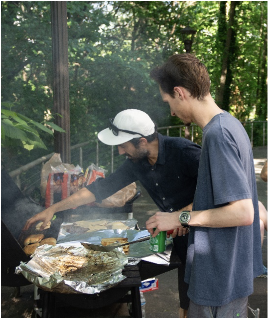 Students grilling at the Spring 2024 celebration of graduates.